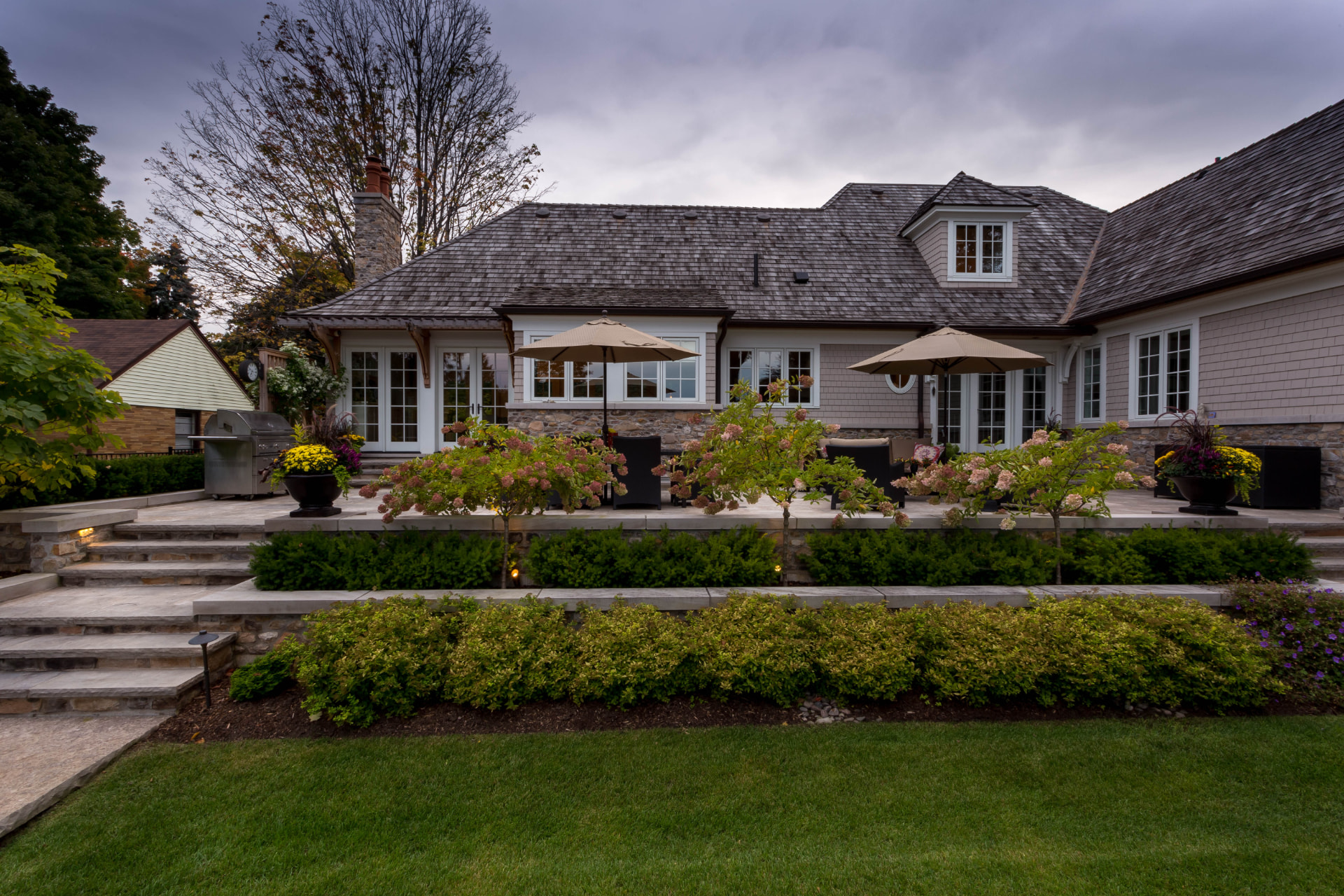 Manicured terrace plantings and hedging kept pristine season after season
